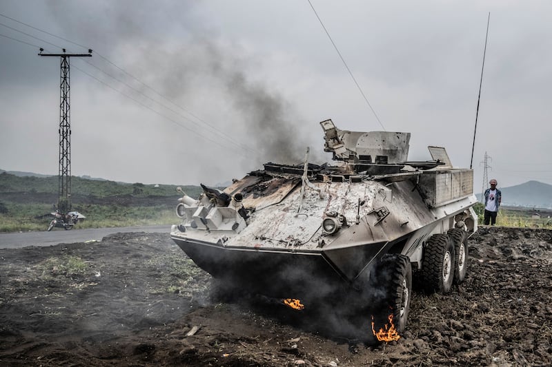 A UN armoured personnel carrier burns during clashes with M23 rebels outside of Goma, DR Congo. Photograp: Moses Sawasawa/AP