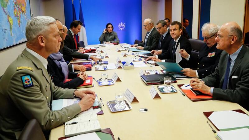 Operation Hamilton: Emmanuel Macron (third right) with ministers and military advisers at the Élysée after France’s joint strikes with the US and UK. Photograph: François Guillot/EPA