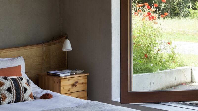 Main bedroom with pivot door. Photograph: Alice Clancy