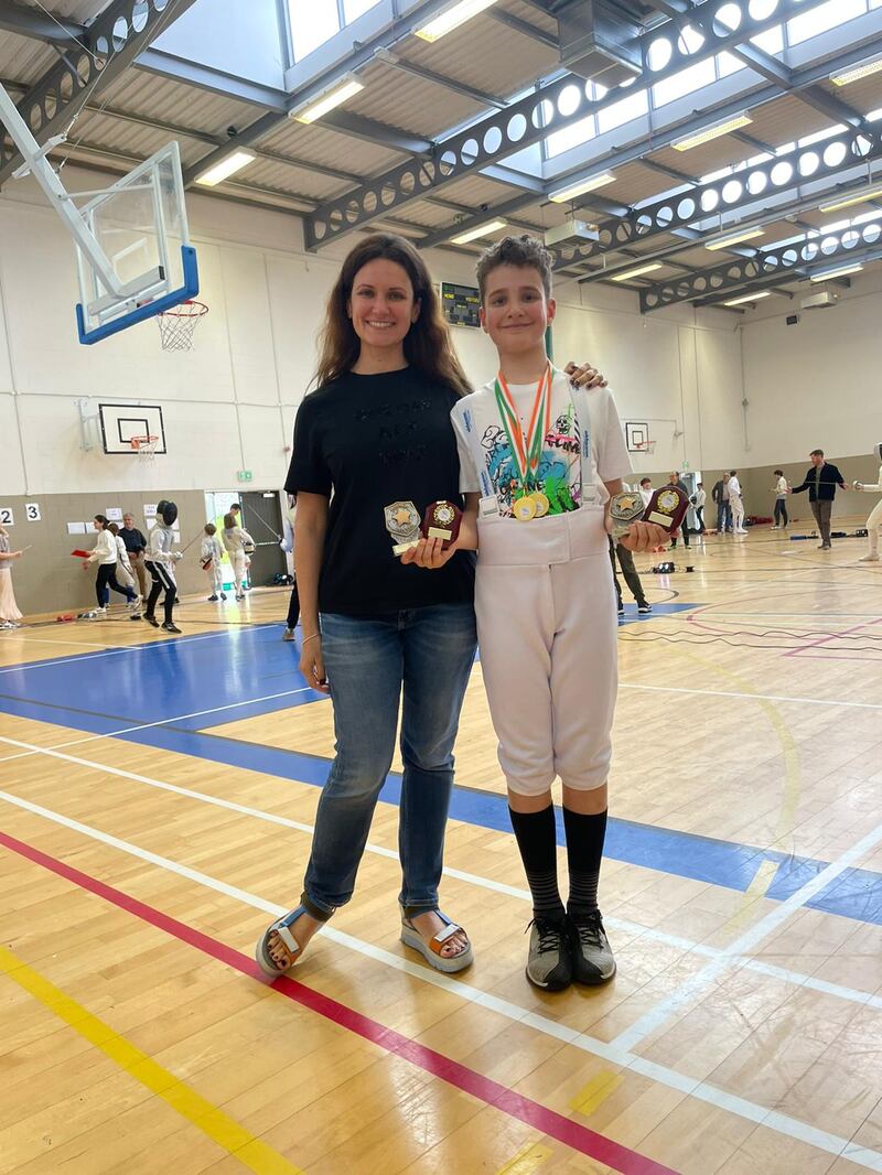 Daniel Karas, 11-year-old fencing champsion from Ukraine, with his mother Alesia