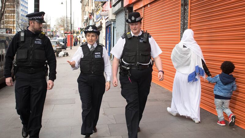 Metropolitan Police Commissioner Cressida Dick (centre) walks with officers through Stoke Newington in north London after a recent spate of gang violence in which several teenagers died. Photograph: Stefan Rousseau/PA Wire.