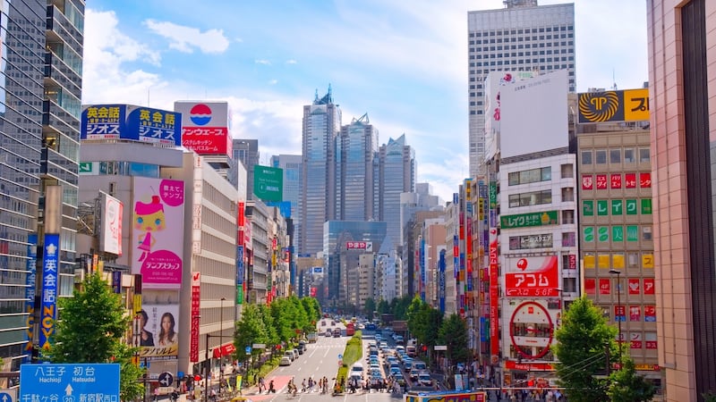 Koshu Kaido in the Shinjuku district of Tokyo, with the Park Hyatt Hotel in the background