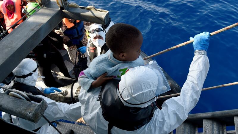 A young boy is lifted aboard the LÉ Eithne of the  coast of Libya. File photograph: Able Seaman David Jones/Defence Forces