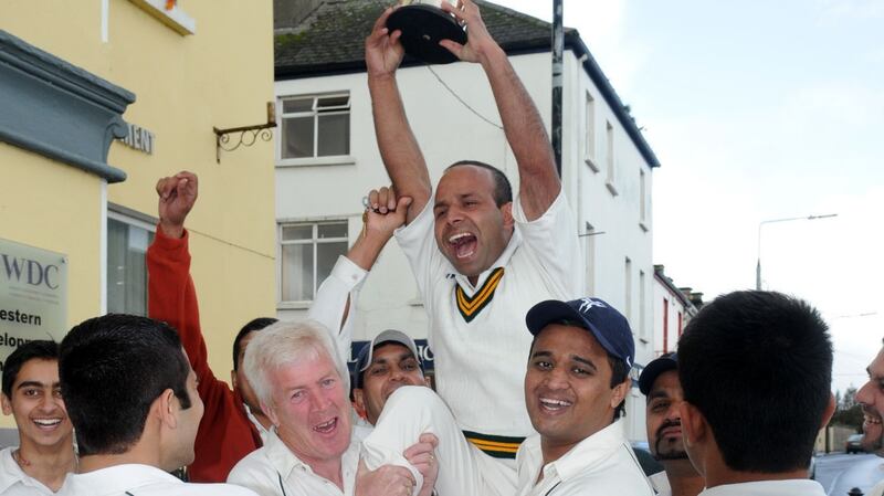 Sajjad Hussain and team-mates celebrate on the streets of Ballaghaderreen after winning the Connacht League . Photograph: Michael McCormack.