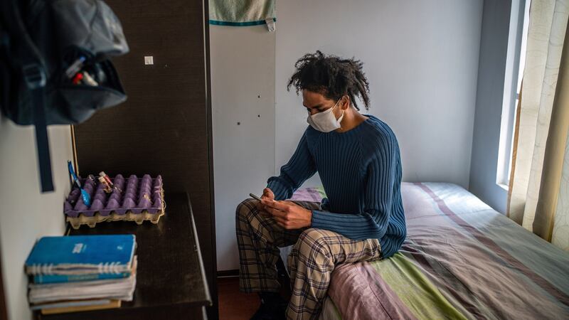 Saulo de Ávila, a psychology student, in his room in Bogotá. Photograph: Federico Rios/New York Times