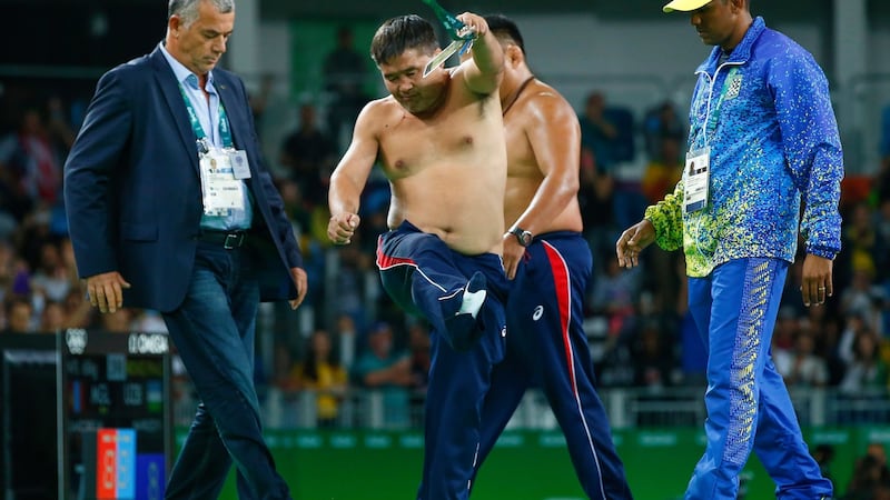 Mongolia’s coaches protest the judges decision after Mandakhnaran Ganzorig is defeated by Ikhtiyor Navruzov of Uzbekistan in the Men’s Freestyle 65kg Bronze match. Photograph: EPA