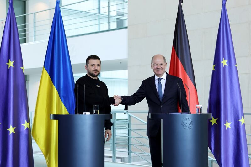 Ukrainian president Volodymyr Zelenskiy and German chancellor Olaf Scholz shake hands during a news conference in Berlin on Sunday. Photograph: Liesa Johannssen-Koppitz/Bloomberg