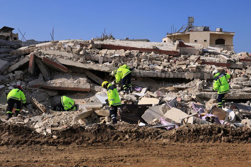 Emirati rescuers continue their search and rescue operations in the regime-controlled town of Jableh in Syria. Photograph: Karim Sahib/AFP via Getty