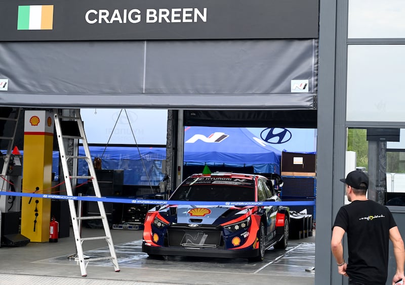 Members of the Hyundai team add Craig Breen's name to a black surface ahead of this week's Croatia Rally in Zagreb, in memory of the driver who was killed during a pre-event test on April 13. Photograph: Denis Lovrovic/AFP/Getty Images