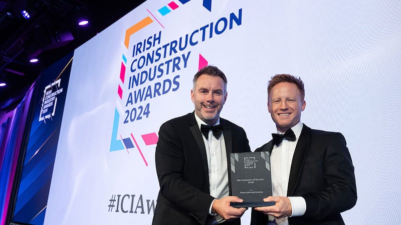 Kevin O'Driscoll, director - partner programmes at BusinessRiver, presents the sub-contractor of the year - small award to Hugh Rainey, Rainey Lightning Protection