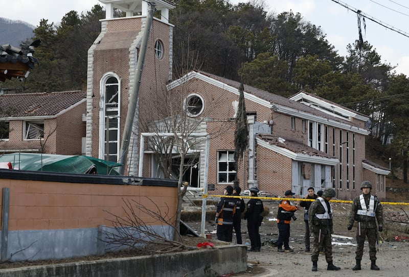 Soldiers and rescue services personnel outside a church in a village, the site of an accidental fighter jet bombing, in Pocheon, South Korea. Photograph: Jeon Heon-Kyun/EPA