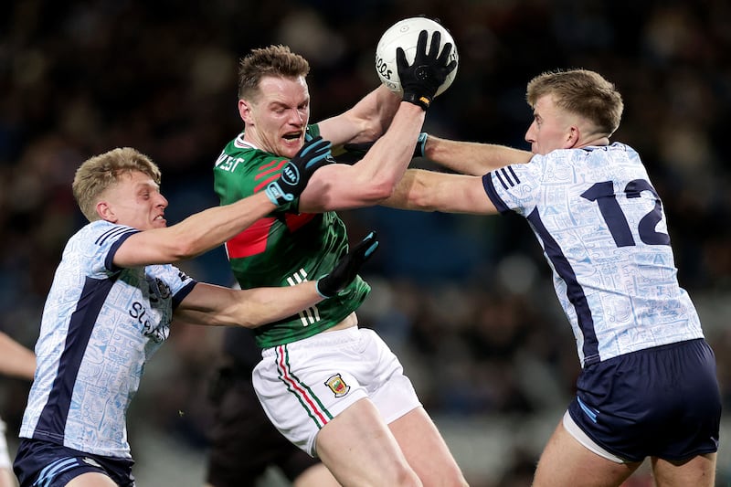 Mayo's Matthew Ruane with is tackled by Cian Murphy and Sean Bugler of Dublin. Photograph: Laszlo Geczo/Inpho