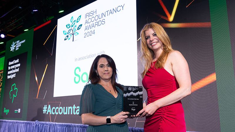 Ade Sproston, sales director, Sage, presents the accountant of the year award to Suzanne Nicholson, BT.