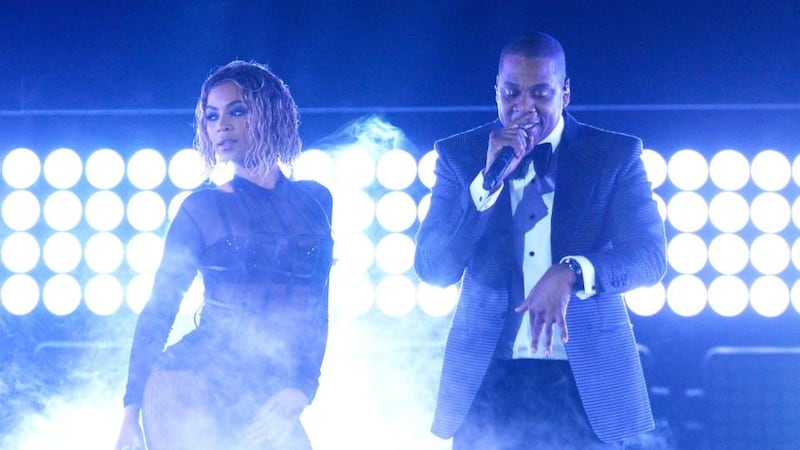 Beyonce and her husband Jay Z perform onstage during the 56th Grammy awards at Staples Centre in Los Angeles.  Photograph:  Kevork Djansezian/Getty Images