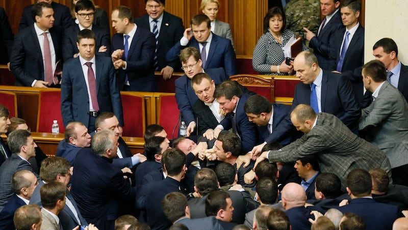 Ukrainian deputies clash with each other during the annual statement in parliament of prime minister Arseniy Yatsenyuk on Friday. Photograph: Sergey Dolzhenko/EPA