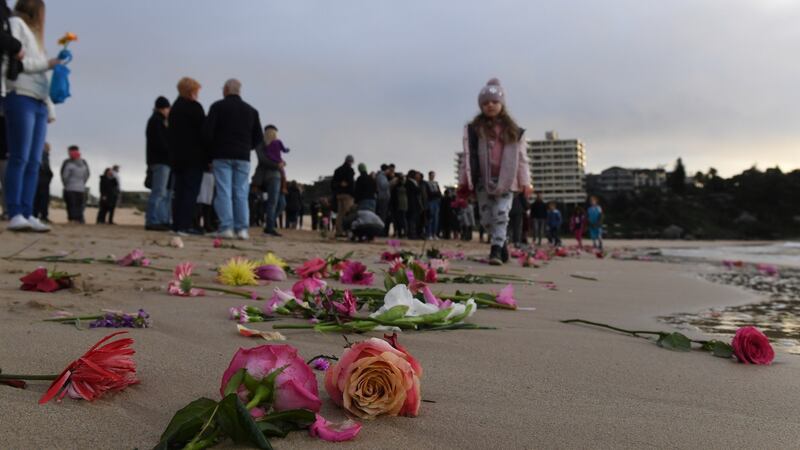 Family and friends gather on Freshwater Beach in Sydney, Australia, in a vigil for  Justine Damond, who was shot dead by a police officer in Minneapolis. Photograph: Dean Lewins/EPA