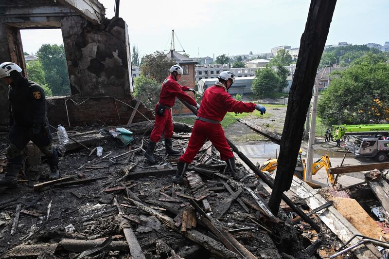 Rescuers clear debris after a drone hit an educational establishment in Kharkiv, on August 1st, amid the Russian invasion of Ukraine. Photograph: Sergey Bobok/AFP via Getty