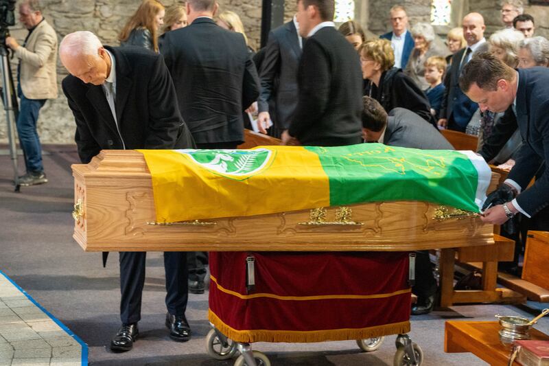 A Kerry flag is draped over Ó Muircheartaigh's coffin during the funeral Mass. Photograph: Noel Sweeney/PA Wire 