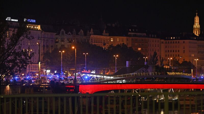 Ambulance cars near Schwedenplatz in Vienna, following a shooting incident. Photograph: Herbert Neubauer/APA/AFP via Getty Images