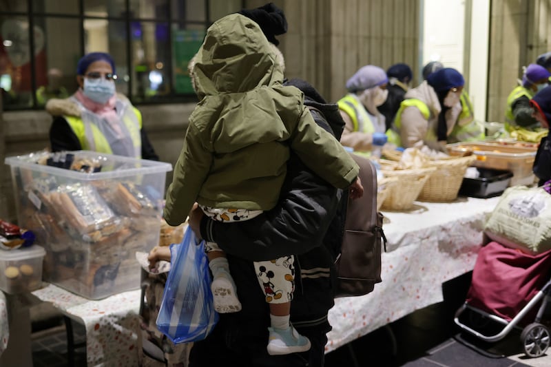 A family at the Muslim Sisters of Éire soup kitchen for the needy at the GPO on Friday. Photograph: Chris Maddaloni