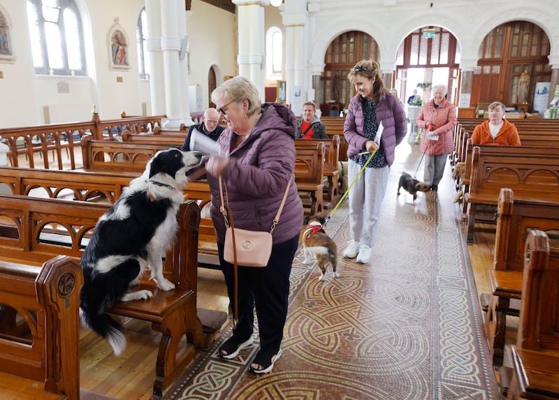 Breda Higgins with her dog Lenny at St Columba’s Church, Iona Rd. Photograph: Alan Betson