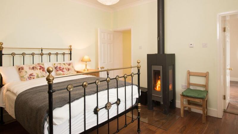 The Jackie O’Grady bedroom with wood-burning stove