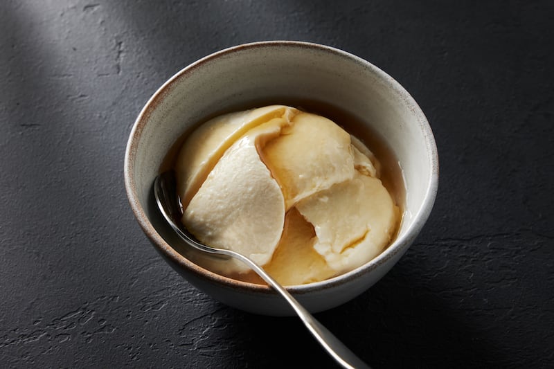 Silken tofu steps into this shortcut version of dòuhuā, a custardy tofu pudding with ginger syrup. Photograph: Bobbi Lin/The New York Times
                      