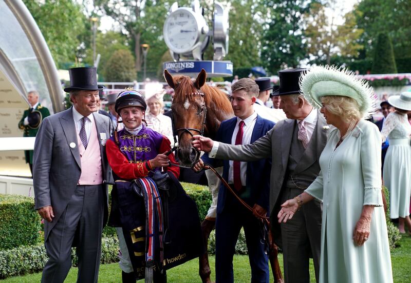 King Charles III and Queen Camilla, owners of Desert Hero ridden by Tom Marquand, and trained by William Haggas (left) following victory in the King George V Stakes on day three of the 2023 Royal Ascot meeting. File photograph: PA