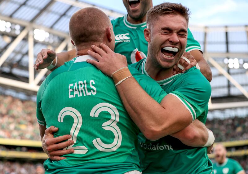 Ireland's Jack Crowley celebrates a try with Keith Earls. Photograph: Dan Sheridan/Inpho