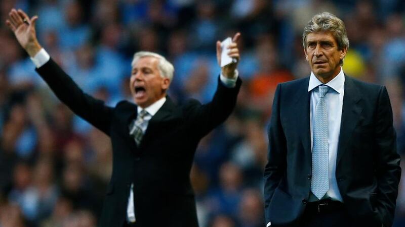 Manchester City’s manager Manuel Pellegrini (right) and  his Newcastle United counterpart Alan Pardew at the Etihad Stadium in Manchester. Photograph: Darren Staples/Reuters