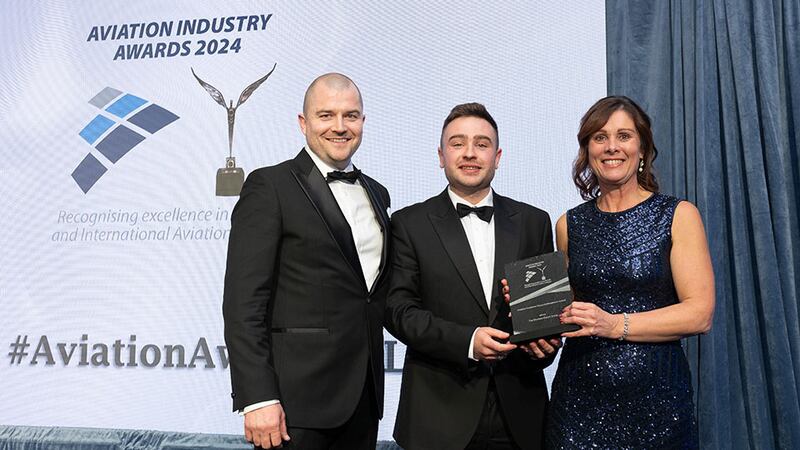 Ben Molloy, community lead at Business River, presents the aviation customer focus achievement award to Niall Kearns and Pamela Brooks, Shannon Airport Group