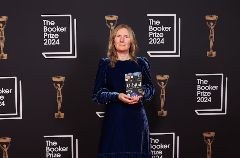 Samantha Harvey with her award-winning novel Orbital. Photograph: David Parry/Booker Prize/PA 

