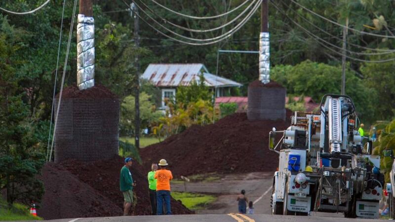 Construction crews prepare Pahoa village Road ahead of the arrival of a  lava flow from Mount Kilauea. Photograph: Reuters