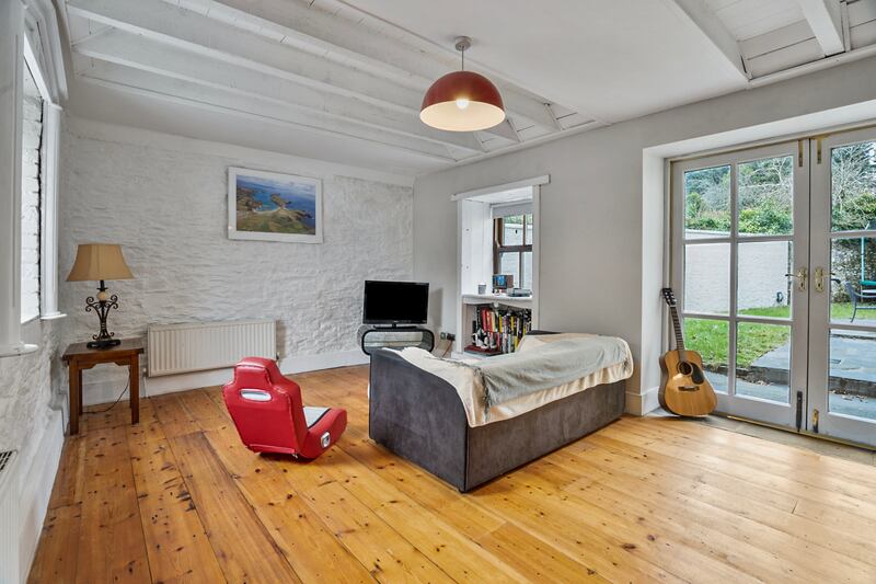 Informal sittingroom with French doors to the patio