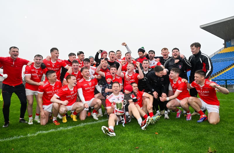 Pádraig Pearses players celebrate with the Fahey Cup after their win over  Roscommon Gaels. Photograph: Inpho