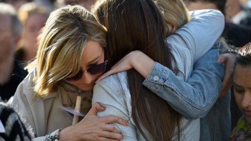 People embrace  in George Square, Glasgow  during a silent vigil for Karen Buckley. Photograph:  Jeff J Mitchell/Getty Images.