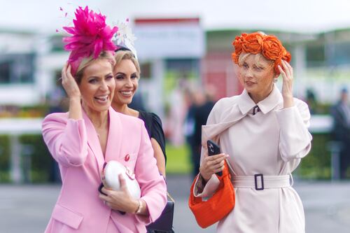 ‘Three to one that hat goes’: Galway Races fashion succumbs to the weather