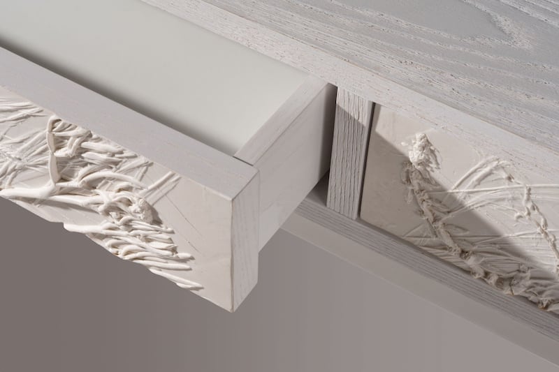 A detail of Erica Devine's work on the drawer fronts of a console table