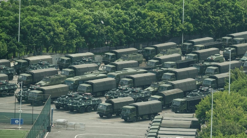 Trucks and armoured personnel carriers outside the Shenzhen Bay stadium in Shenzhen, bordering Hong Kong in China’s southern Guangdong province, on Thursday. Photograph: AFP/Getty Images