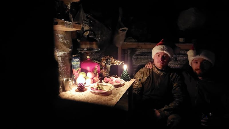 A New Year's Eve picture from their frontline dugout by Warrior and Strila (meaning Arrow), the call-signs of two men in Lt Yulia Mykytenko's reconnaissance platoon. Photograph: Lt Yulia Mykytenko