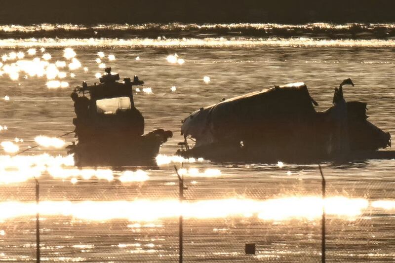 Part of the wreckage is seen as rescue crews search the waters of the Potomac River after a passenger plane on approach to Reagan National Airport crashed into the river after colliding with a US Army helicopter. Photograph: ANDREW CABALLERO-REYNOLDS/AFP via Getty Images