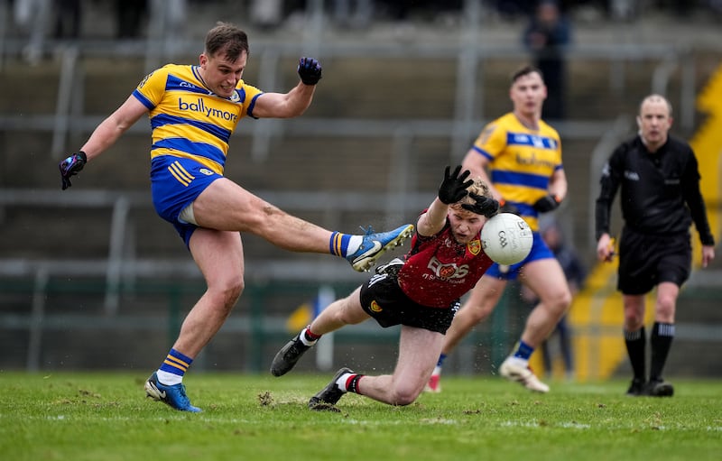 Roscommon's Enda Smith has a shot blocked by Down's Paddy McCarthy. Photograph: James Lawlor/Inpho