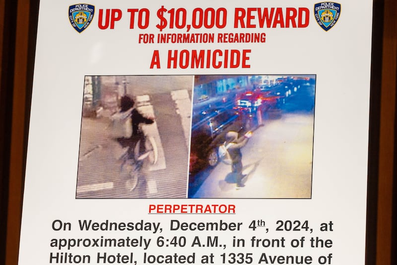 A wanted poster at an NYPD press conference following the shooting of Brian Thompson. Photograph: Alex Kent/Getty