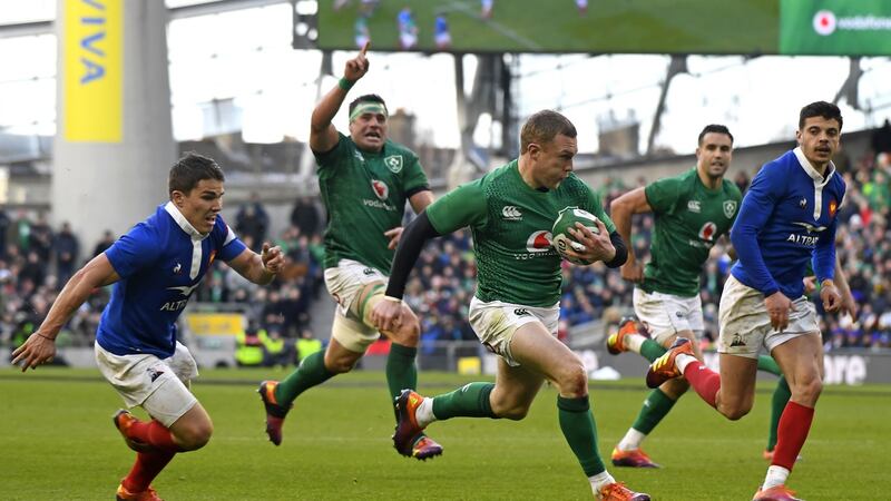 Keith Earls streaks away to score a try. Photo: Damien Meyer/Getty Images