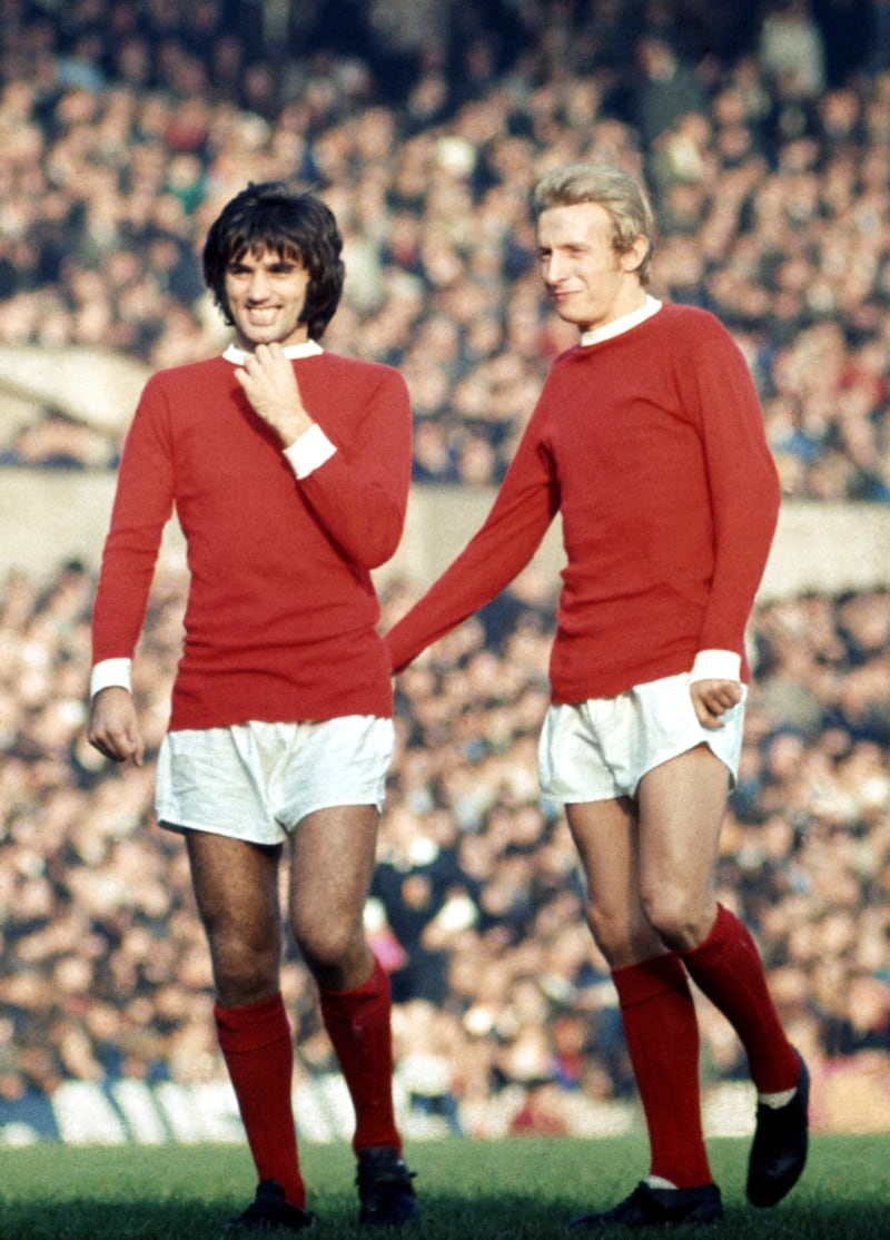 Manchester United team-mates George Best and Denis Law during a game against Stoke City in November 1969. Photograph: Ernest Chapman/Mirror Syndication International/Mirrorpix via Getty Images