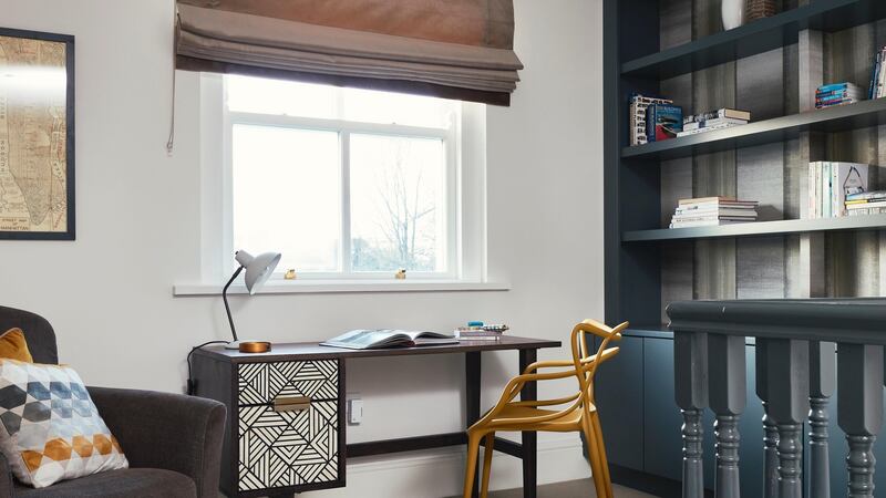 A wall was removed from the office at the top of the stairs and replaced by bannisters to create an open-plan, multi-functional, brighter space. Photograph: Philip Lauterbach