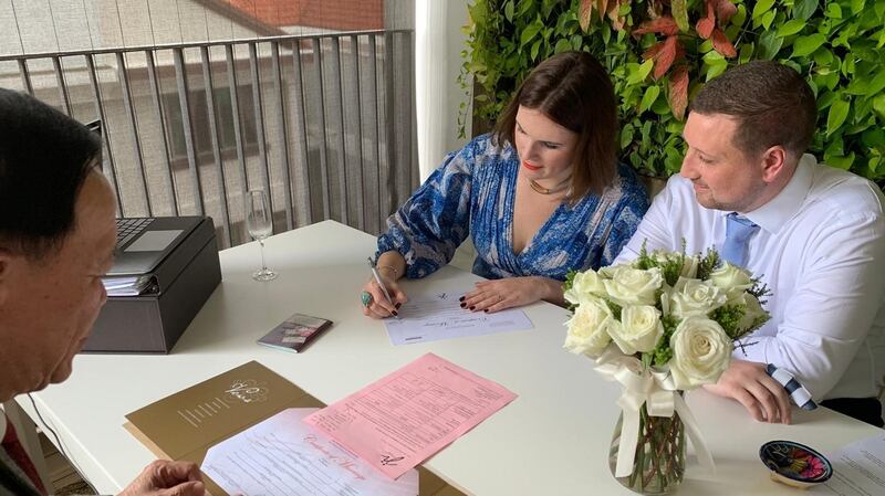 Jennifer O’Connell with her partner on their wedding day in Singapore.