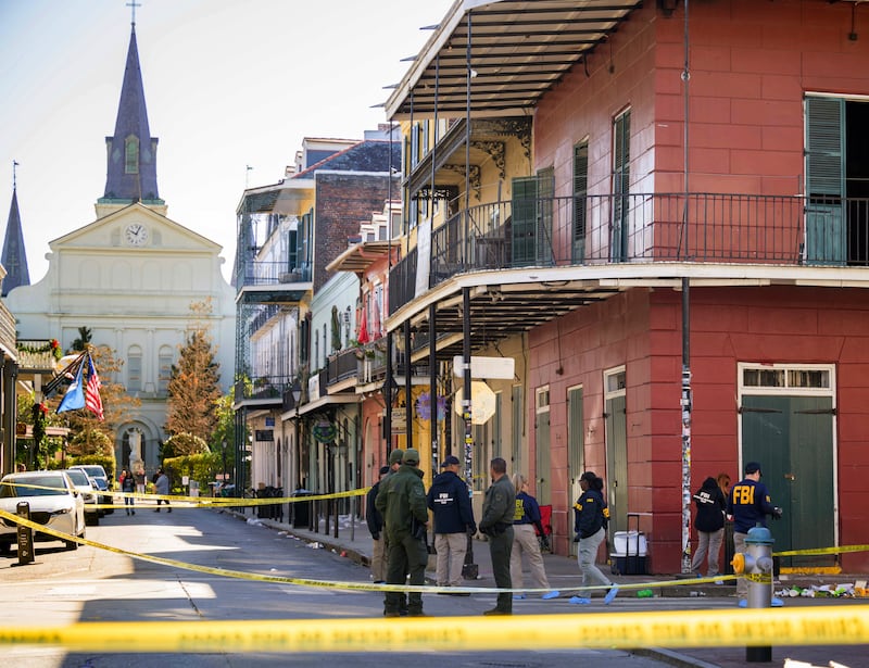 FBI investigators search the junction of Orleans Street and Bourbon Street near St Louis Cathedral in the French Quarter of New Orleans, in the wake of the pickup truck attack. Photograph: Matthew Hinton/AP