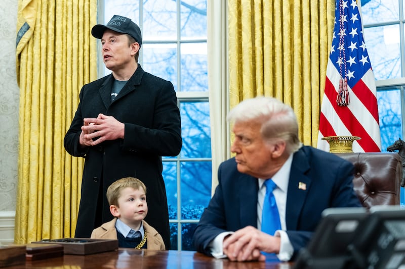 Elon Musk, with his son X, speaks to reporters alongside president Donald Trump in the Oval Office of the White House. Photograph: Eric Lee/The New York Times
                      