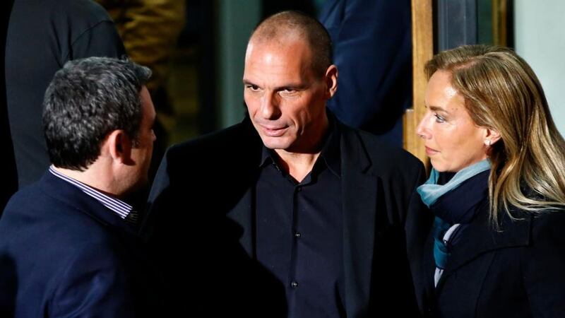 Greek economist Yanis Varoufakis (C), who has been appointed minister for finance, is seen outside the Syriza party headquarters in Athens on Sunday. Photograph: Reuters.